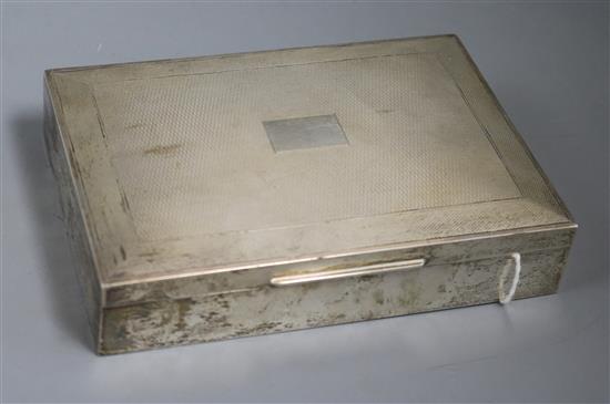 A 1950s silver engine turned cigarette box, Harman Brothers, Birmingham, 16.4cm.